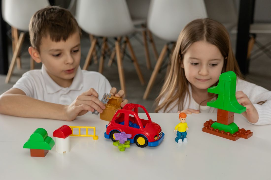 Children enjoying imaginative play with colorful building blocks